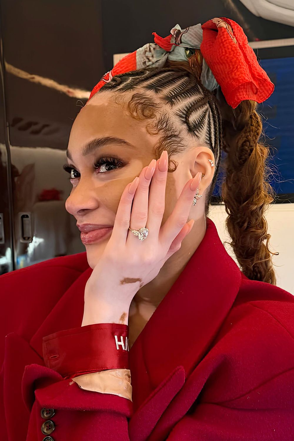 Winnie Harlow posing with her engagement nails in milky neutral shade