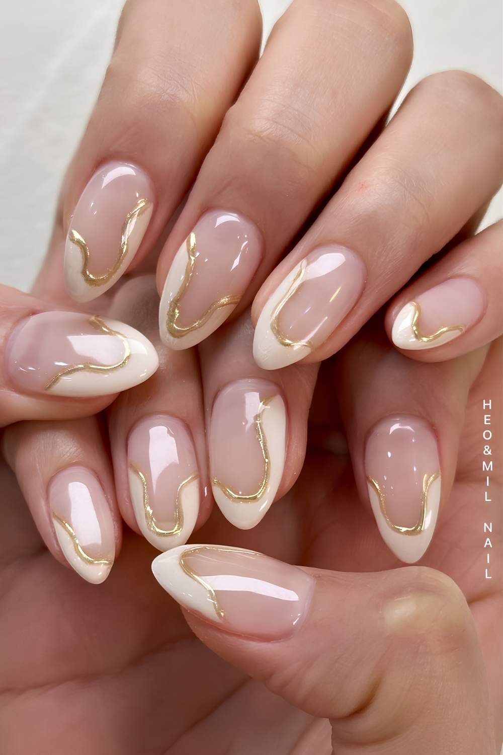 Abstract vanilla and gold French manicure
