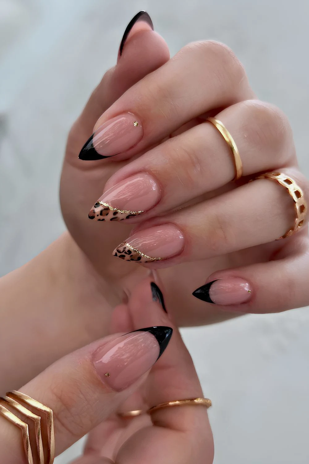 Black French manicure with leopard print accent