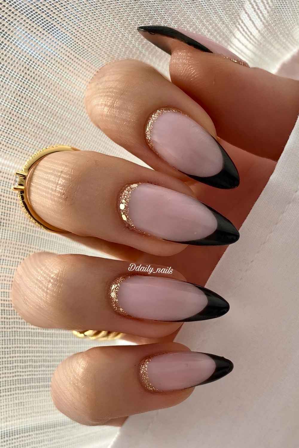 Black French nails with gold cuticle glitter