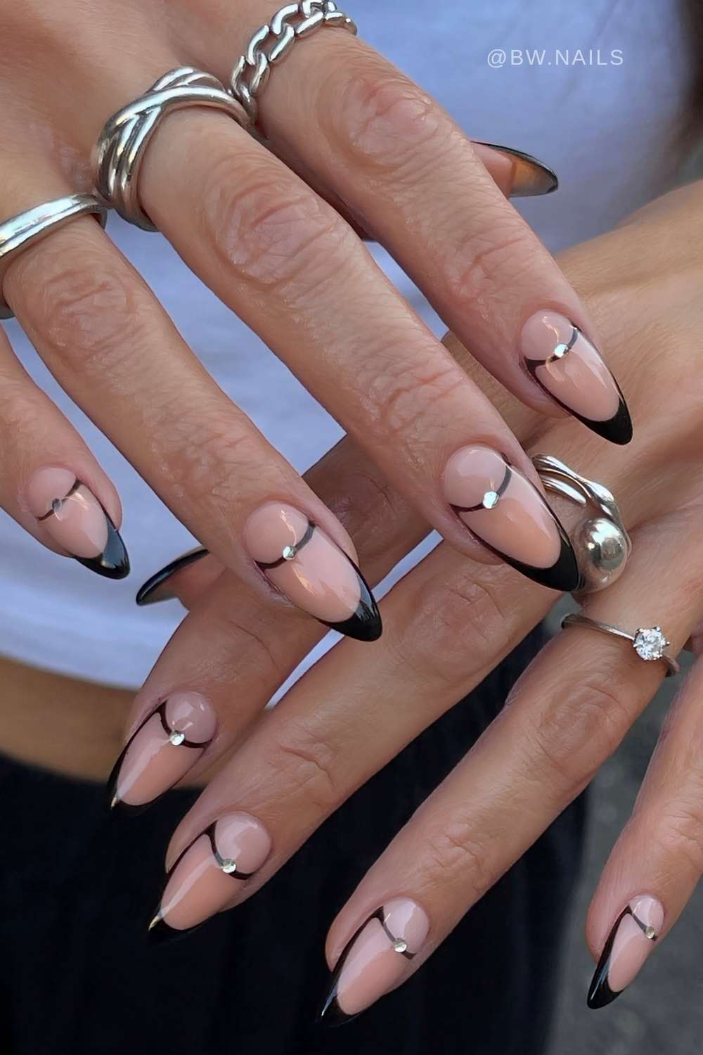 Black French nails with half moons and gems
