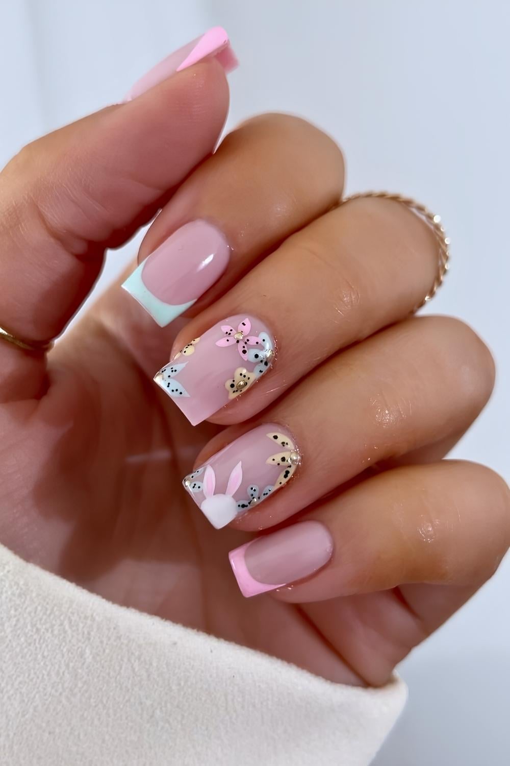 Blue and white French mani with speckled egg and bunny art