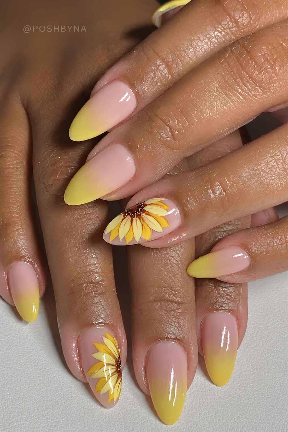 Bright yellow ombre nails with sunflowers