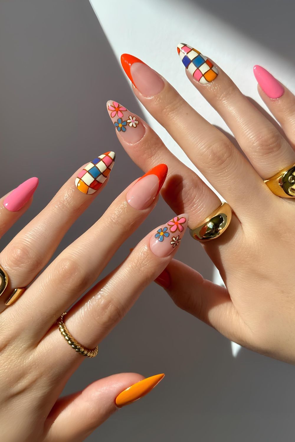 Colorful mix and match mani with flowers and checkerboards