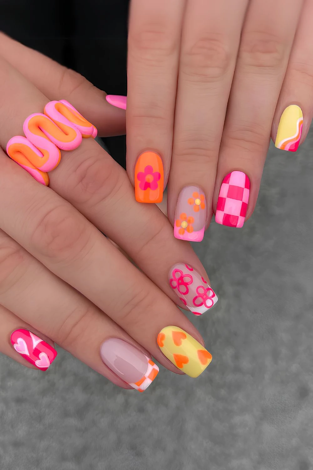 Colorful mix and match nails with flowers and checkerboards