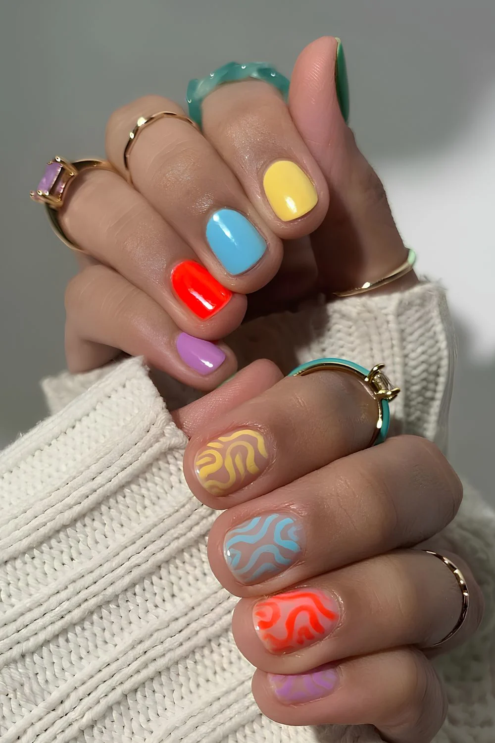 Colorful skittle mani with accent swirls