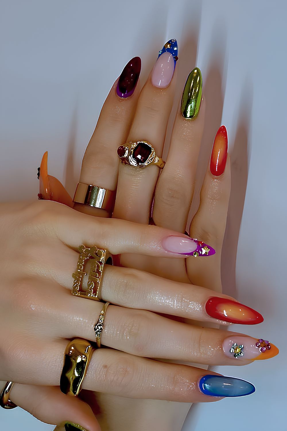 Colorful skittle nails with chrome and gem accents