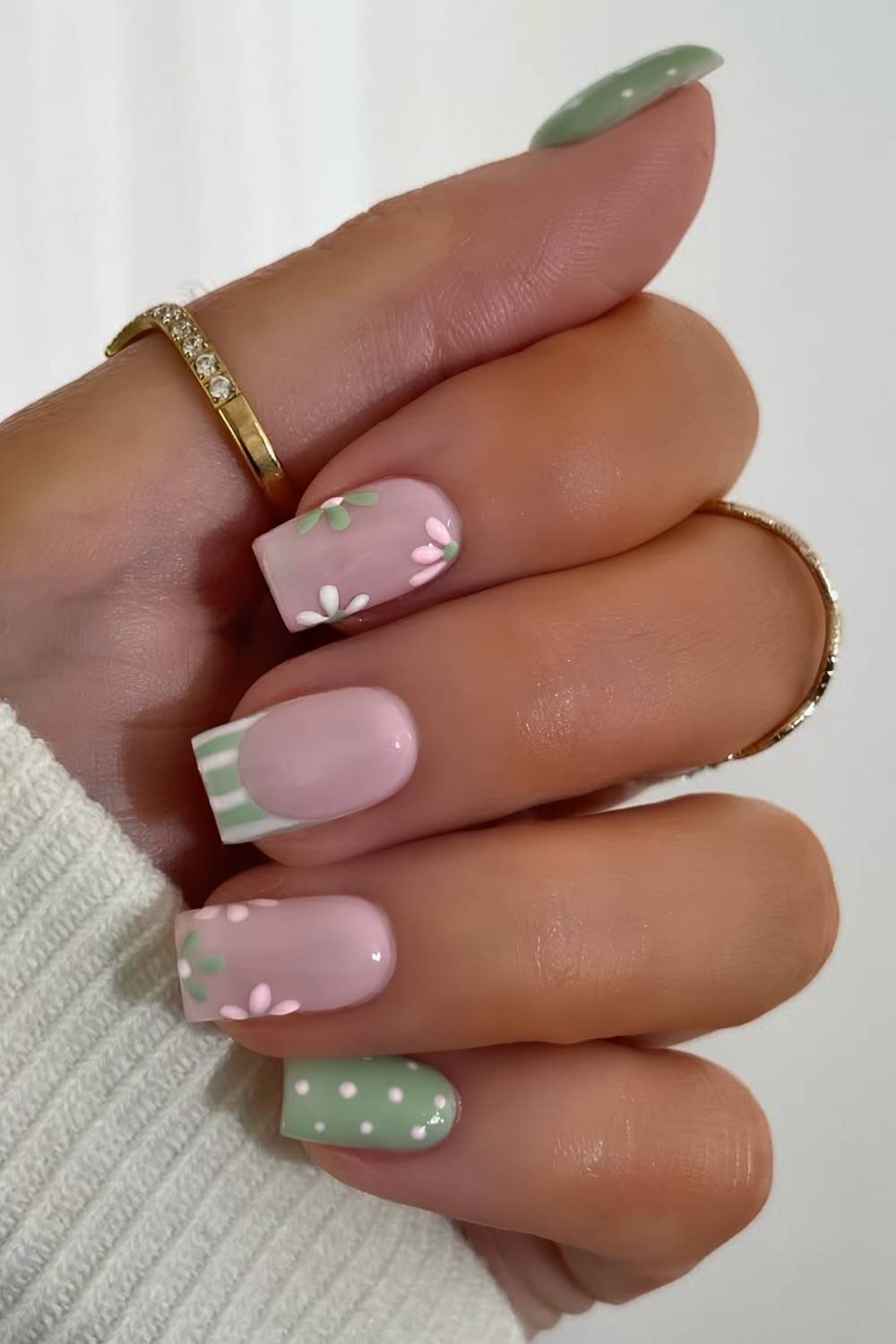 Green and pink mani with flowers and stripes