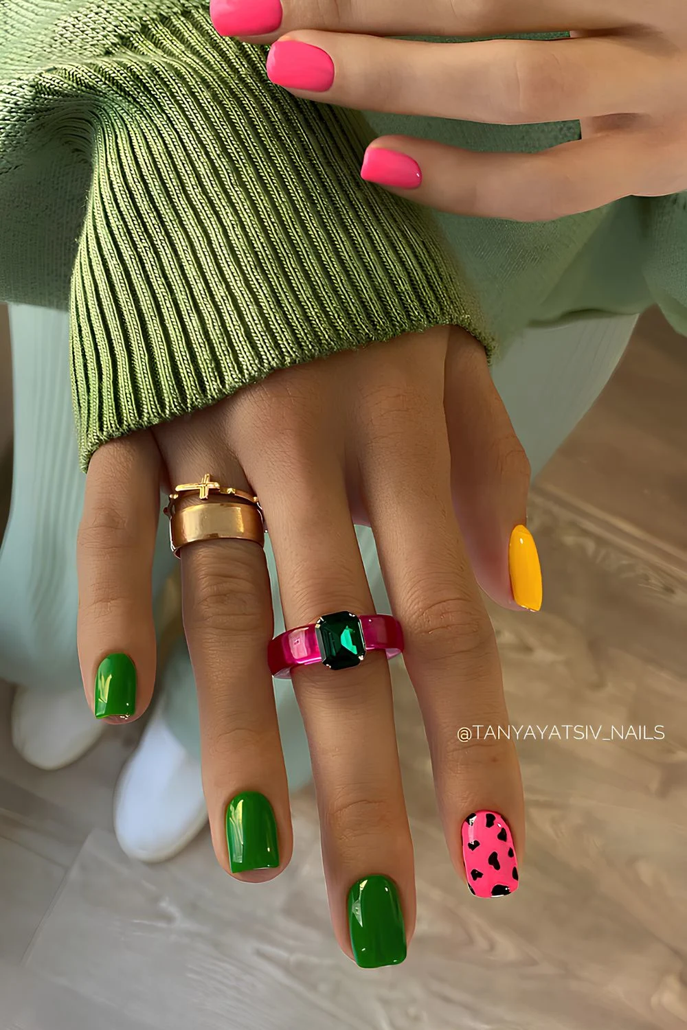 Green and pink nails with animal print accent