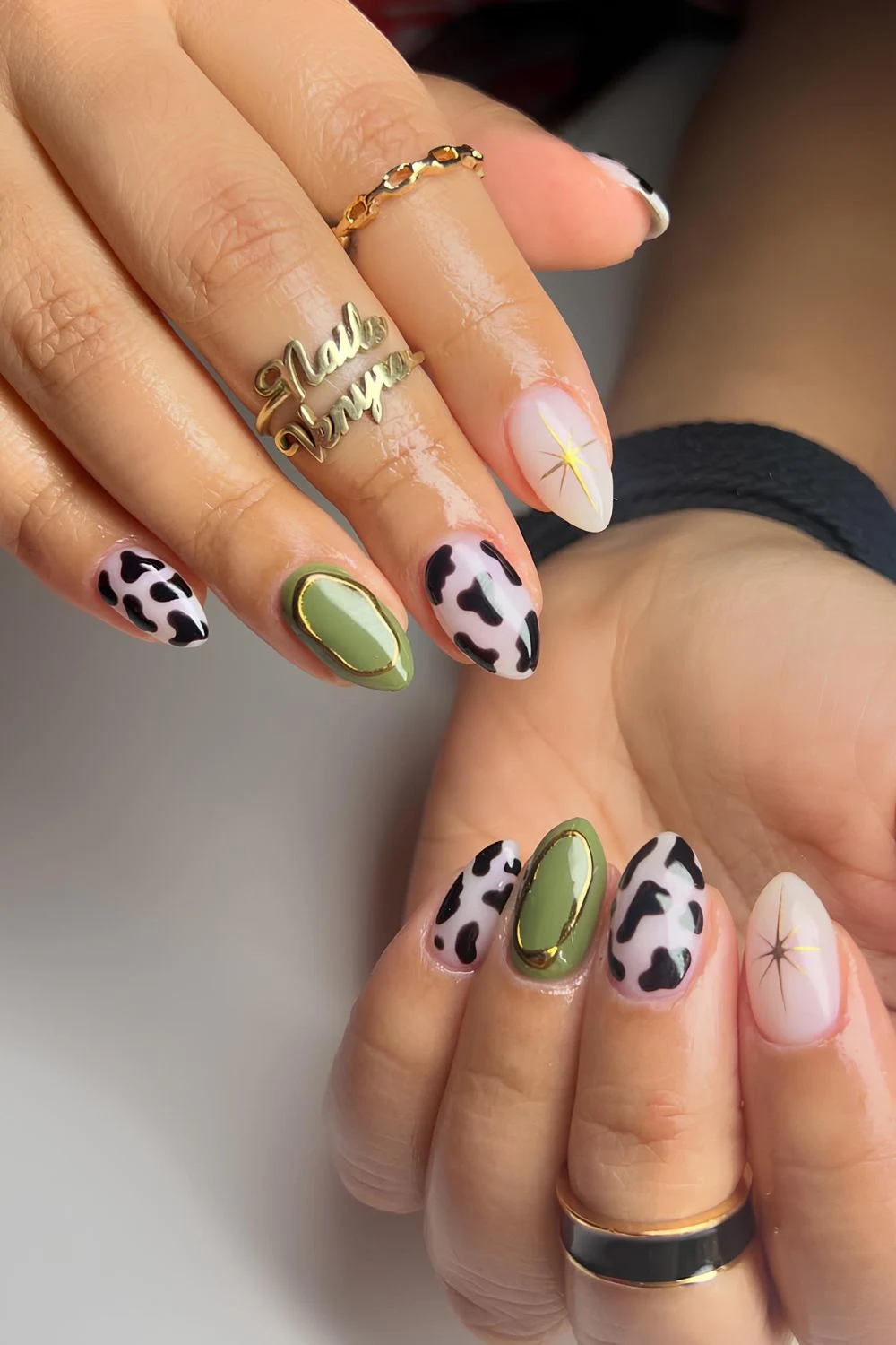 Green and white nails mwith cow print accents