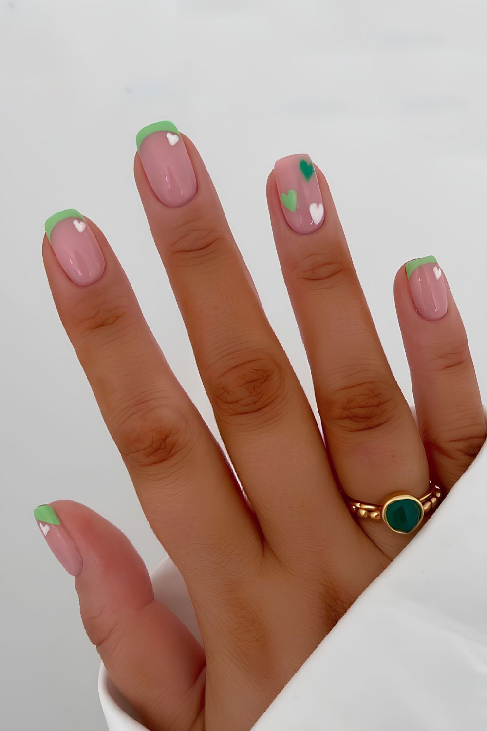 Light green French nails with hearts