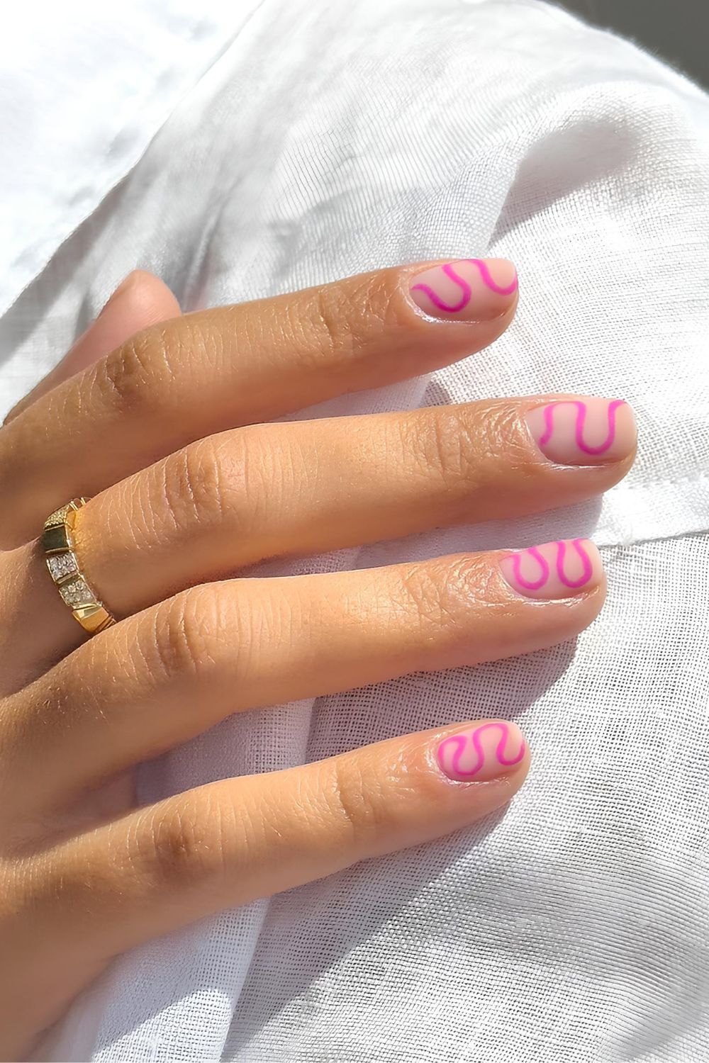 Mate nails with pink swirls