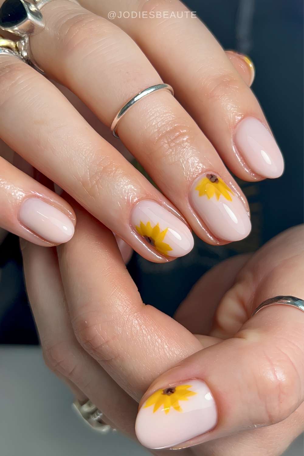Milky manicure with sunflower art