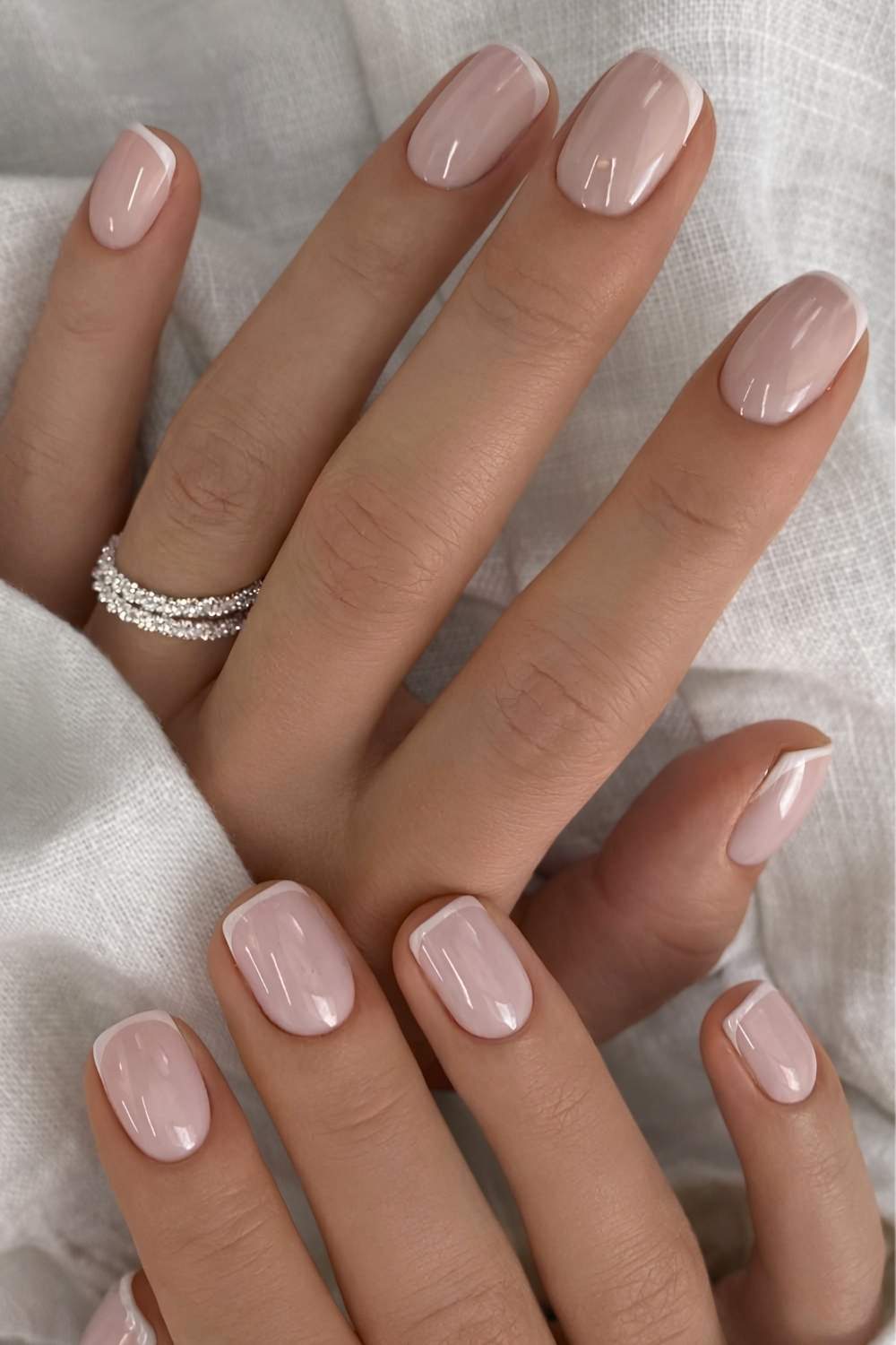 Mini white French mani on a milky base