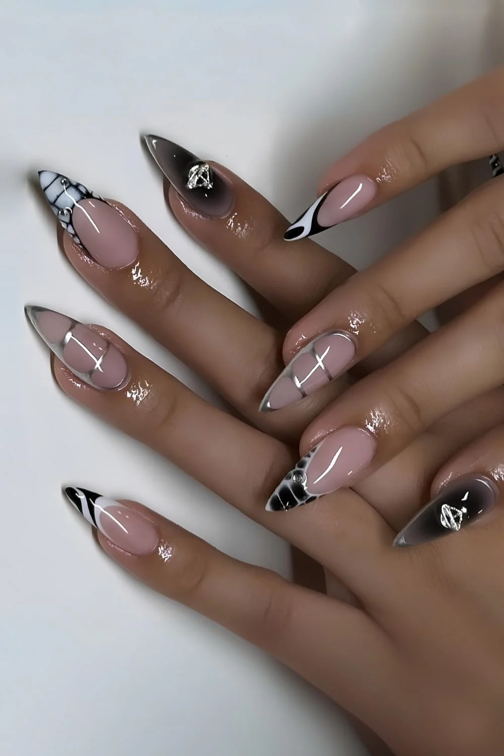 Monochrome mix and match mani with silver accents