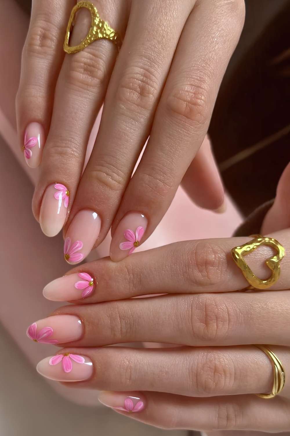 Neutral nails with pink cherry blossoms