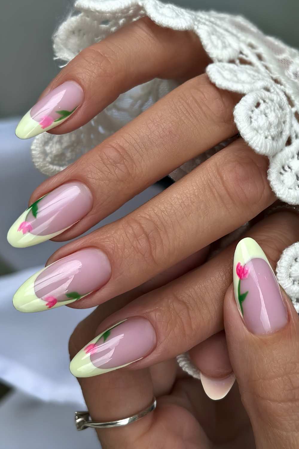 Pastel yellow French nails with pink tulip art