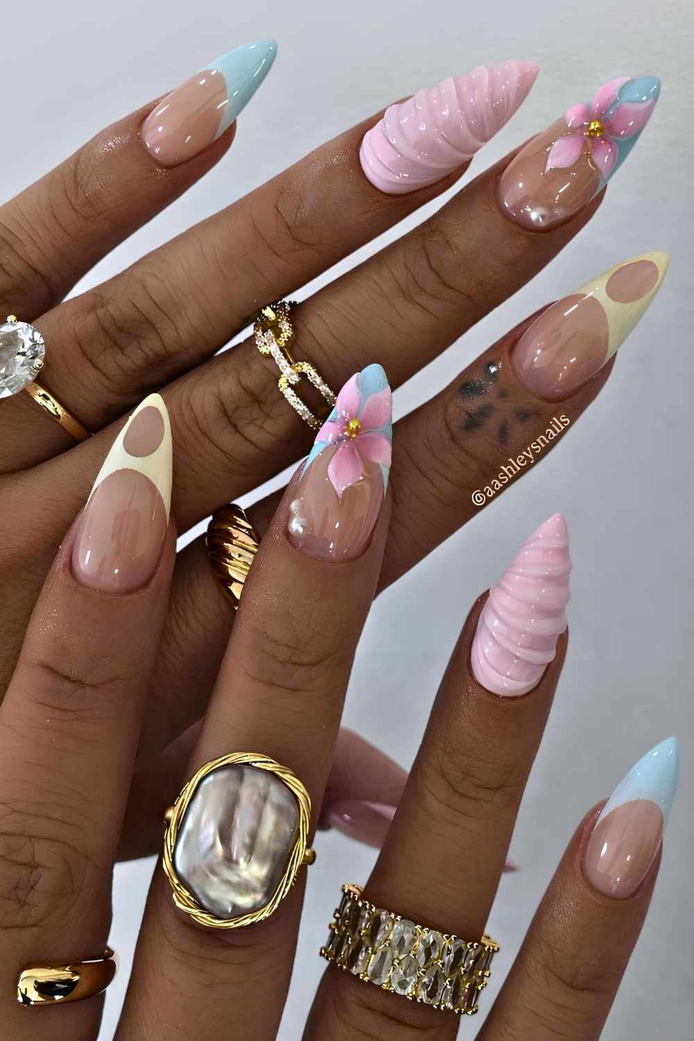Pastel mix and match mani with flowers and swirls