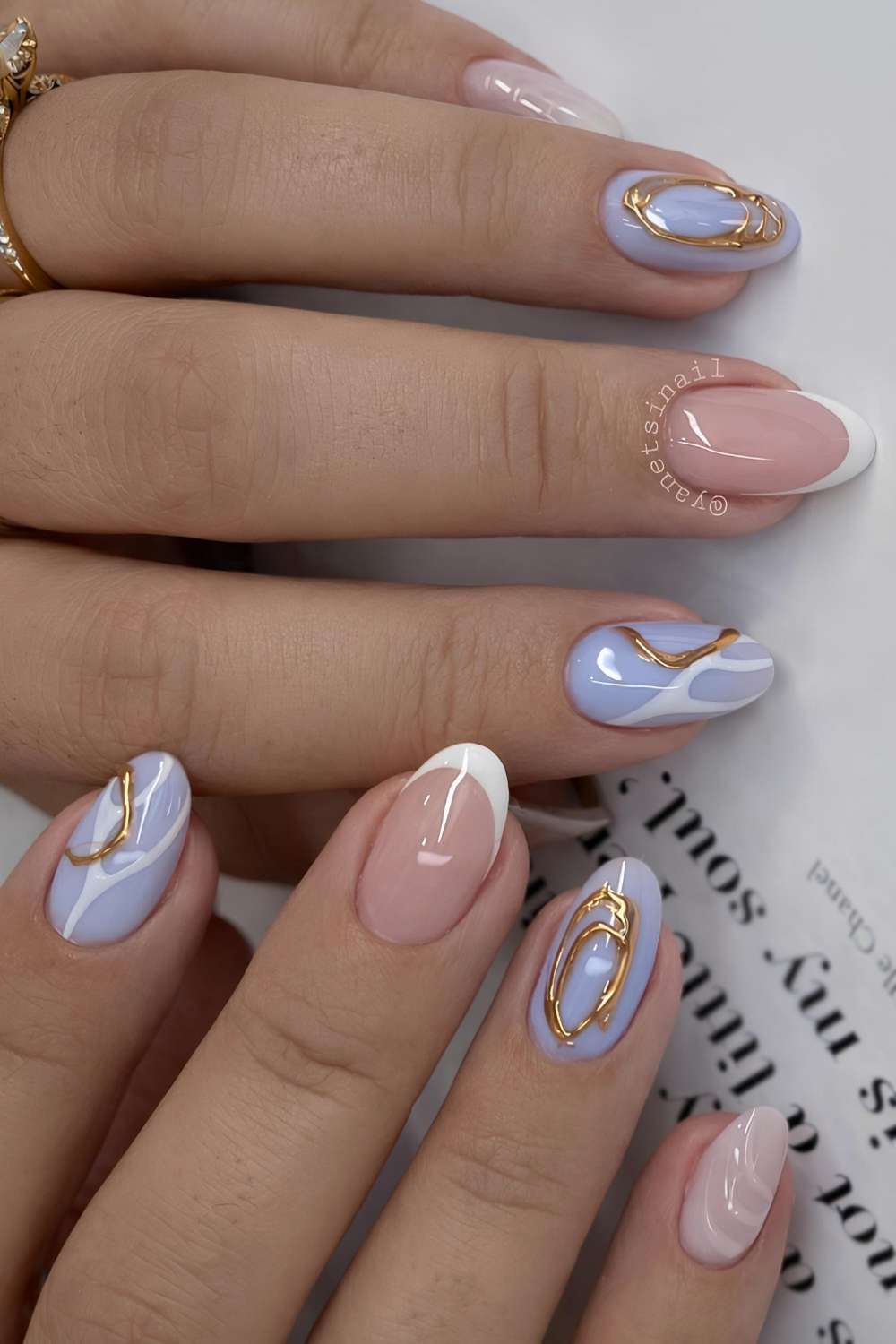 Periwinkle and white nails with gold accents