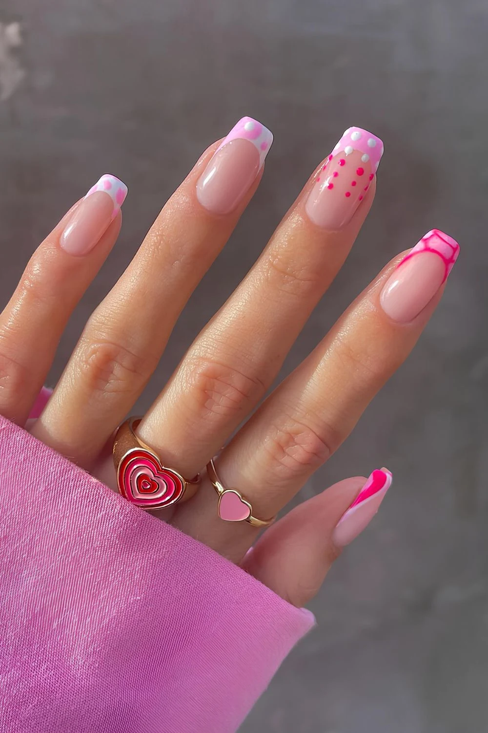 Pink French nails with dots, animal print and swirls