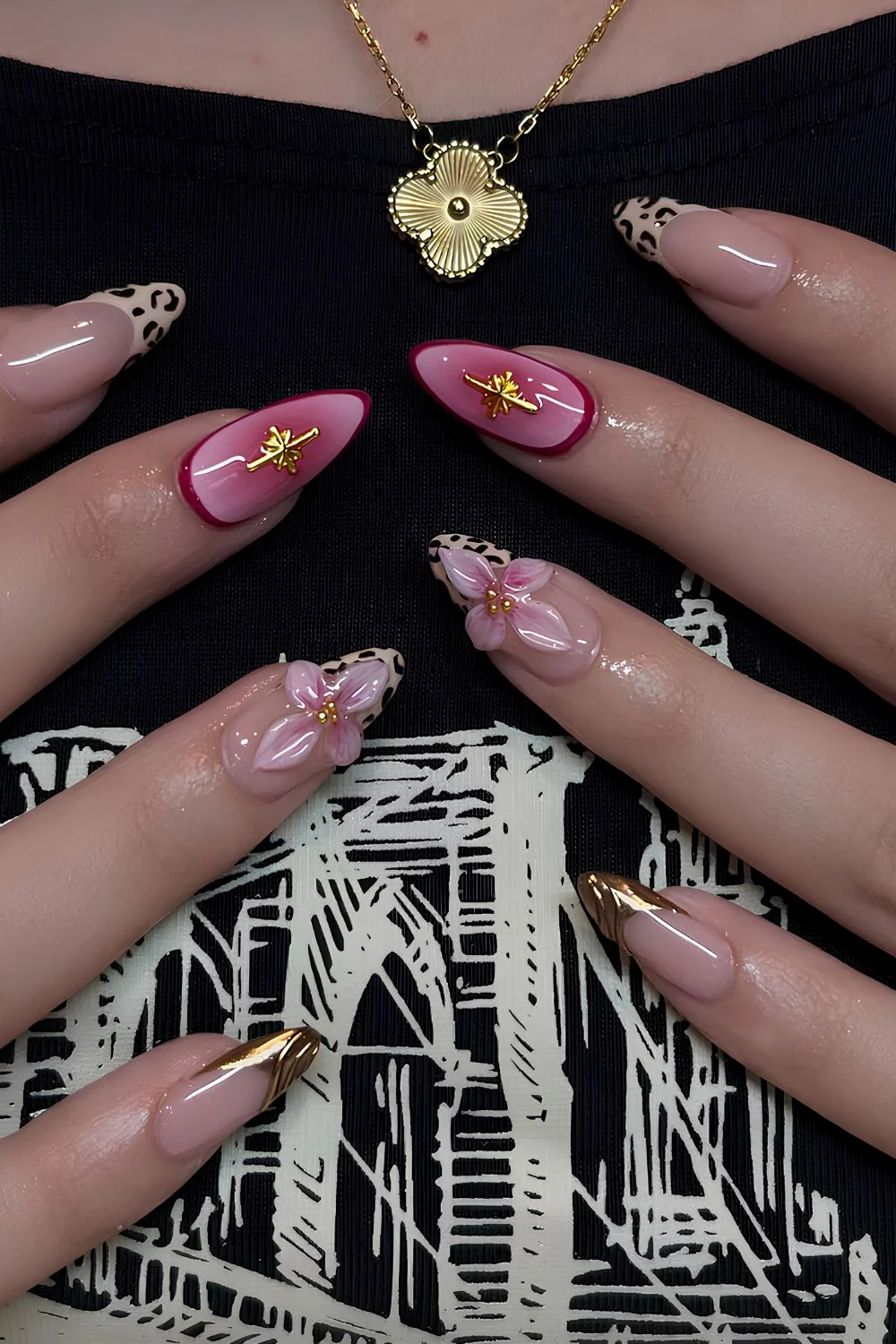 Pink and gold nails with flowers and animal print