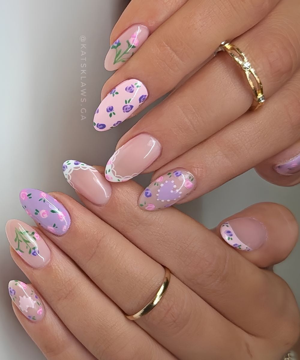 Pink and purple nails with rose and lace art