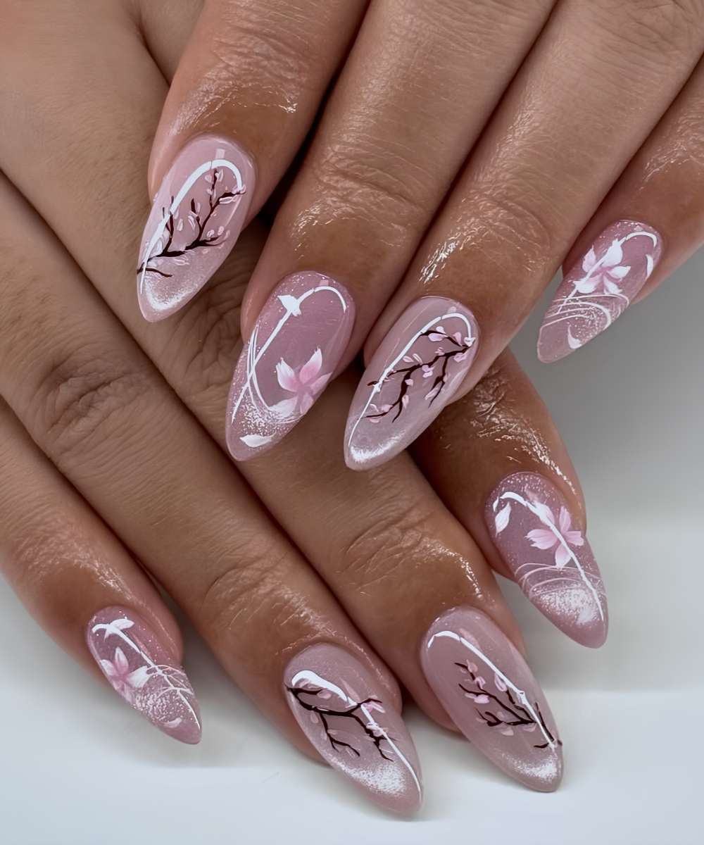 Pink cat eye nails with cherry blossom details