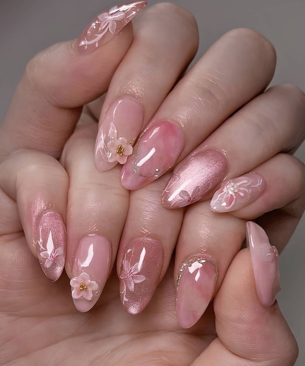 Pink cat eye nails with textured sakura art