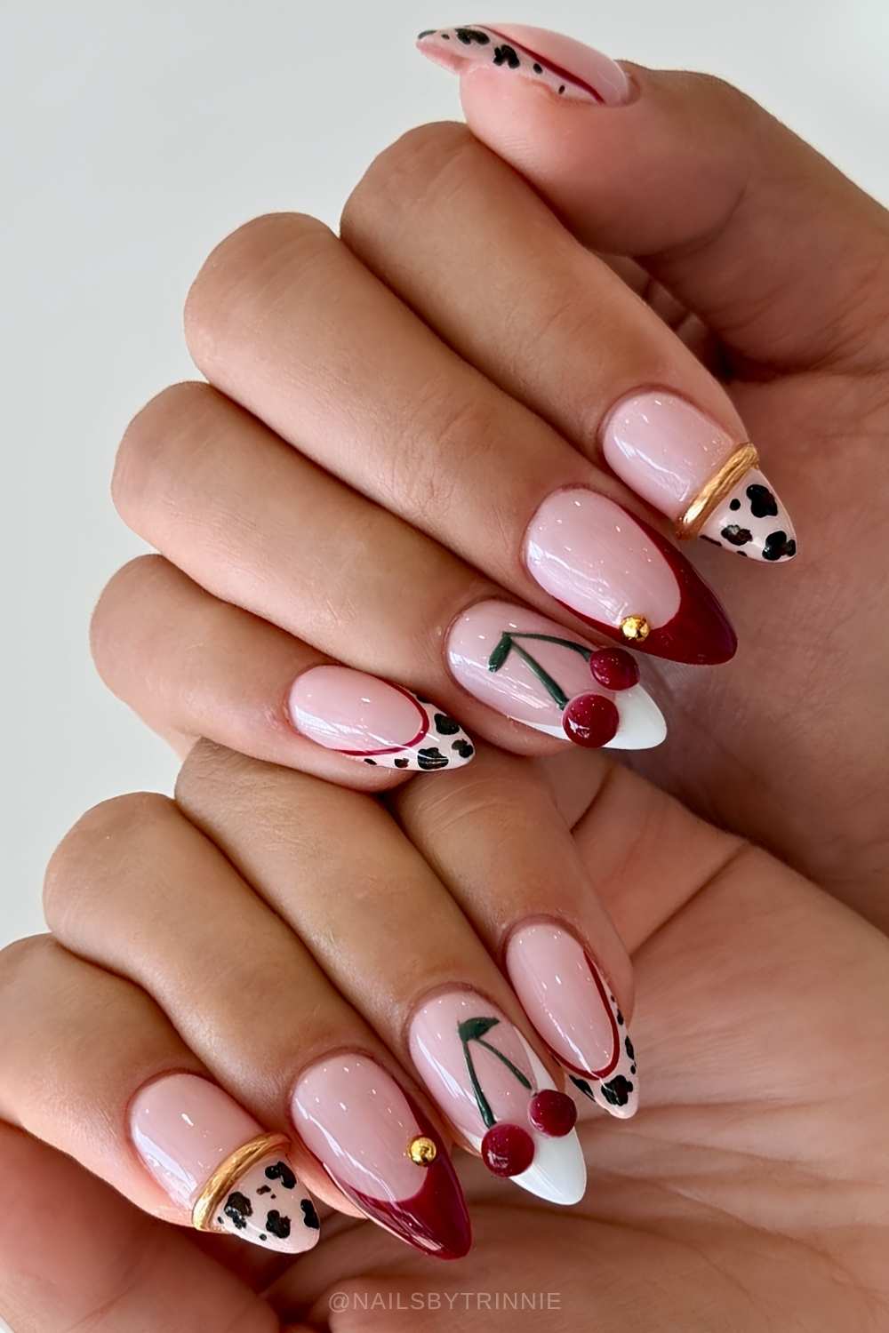 Red and white French mani with cherries and bangle art