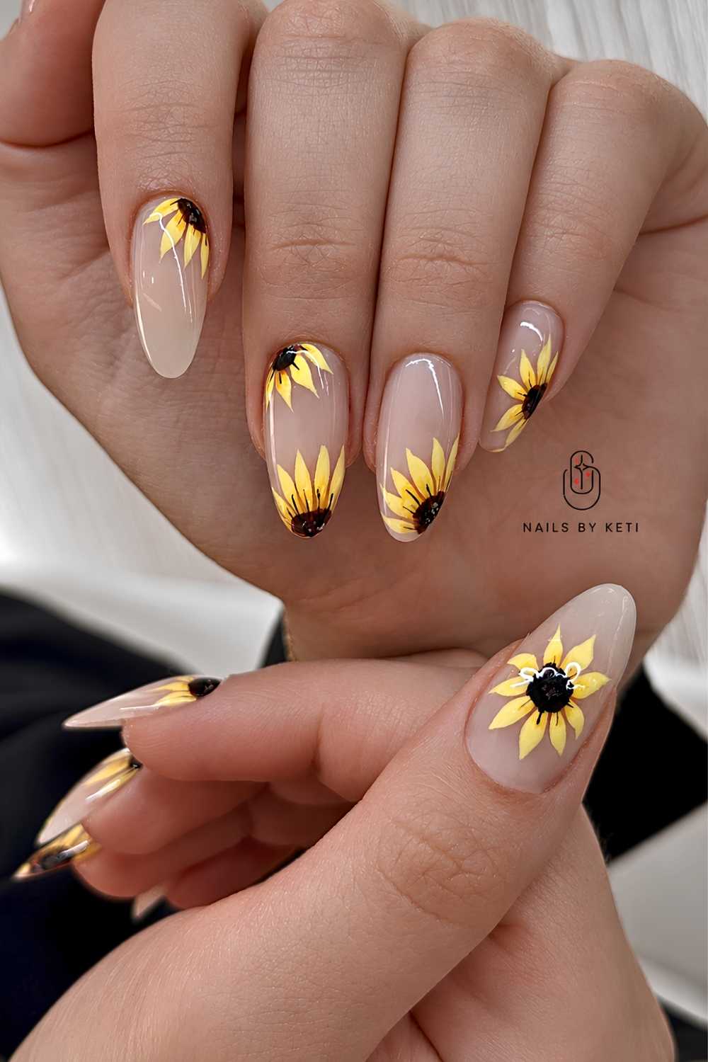 Sheer almond mani with sunflower art