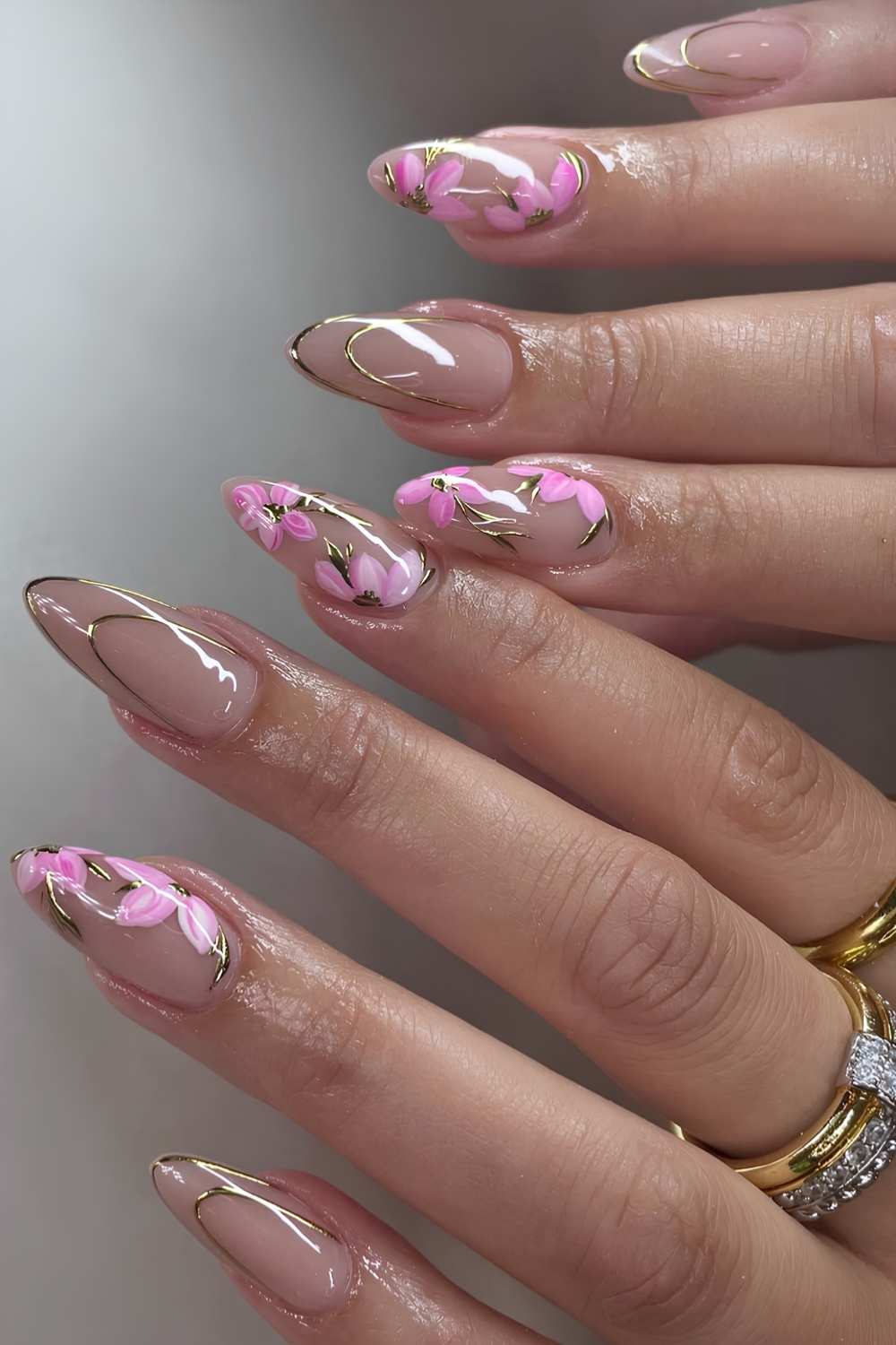 Sheer mani with pink sakura art and gold details