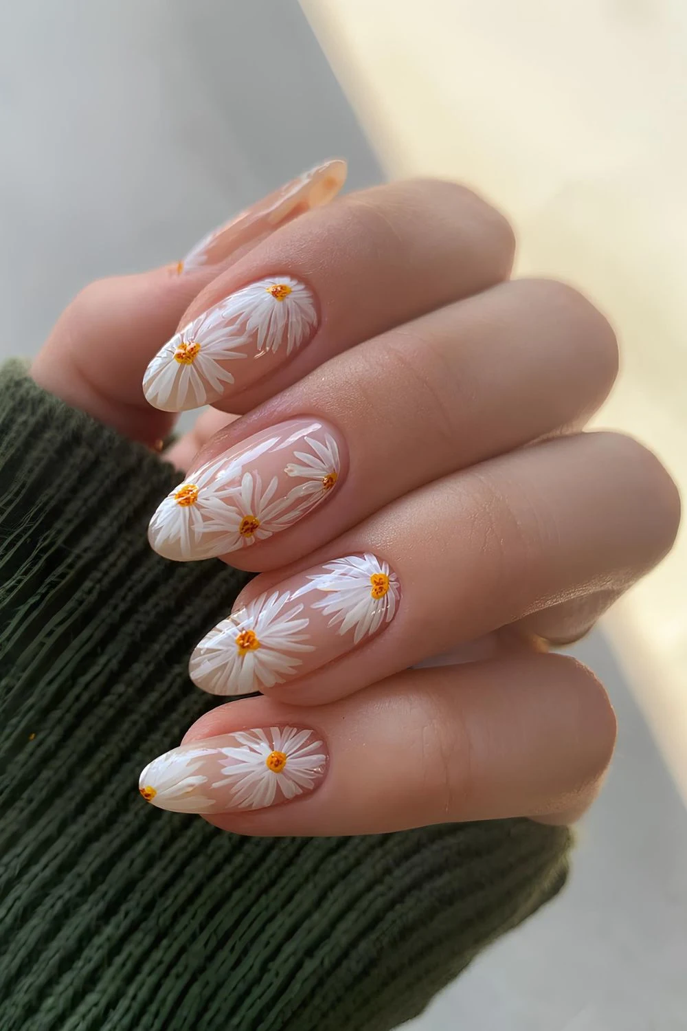 Sheer pink nails with white daisy art