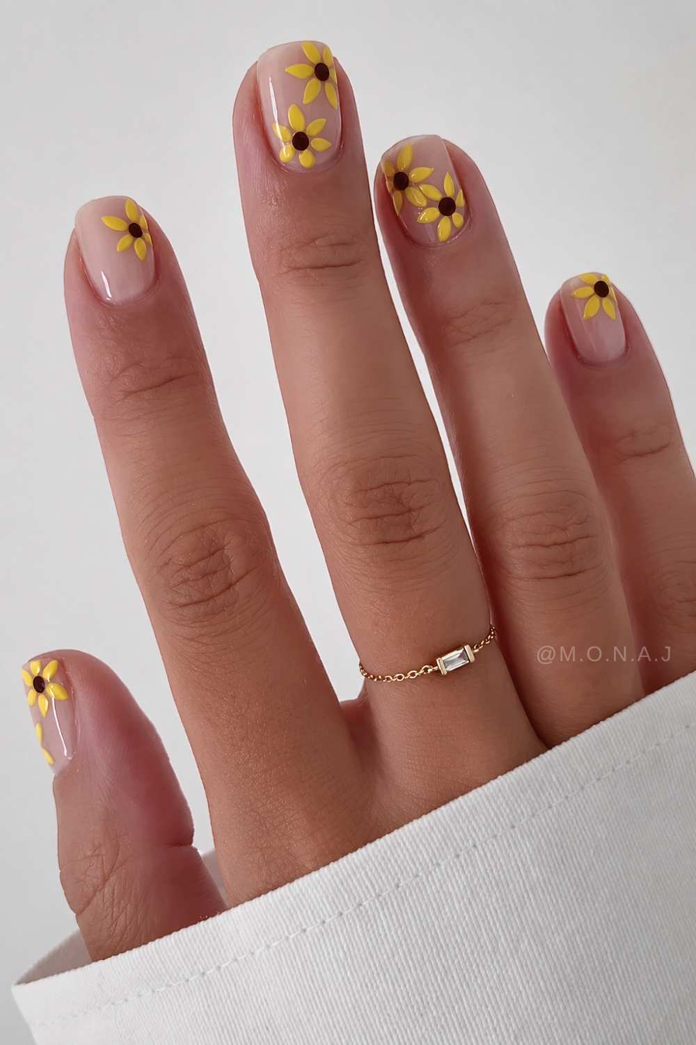 Short milky nails with sunflowers