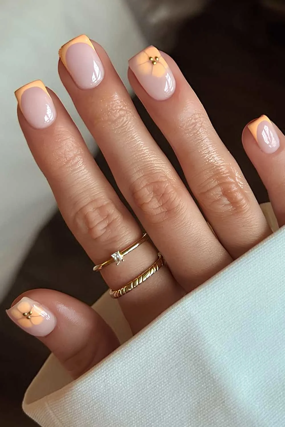 Short peach French mani with floral art