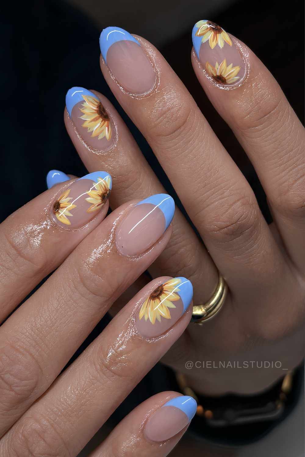Sky blue French nails with yellow sunflowers