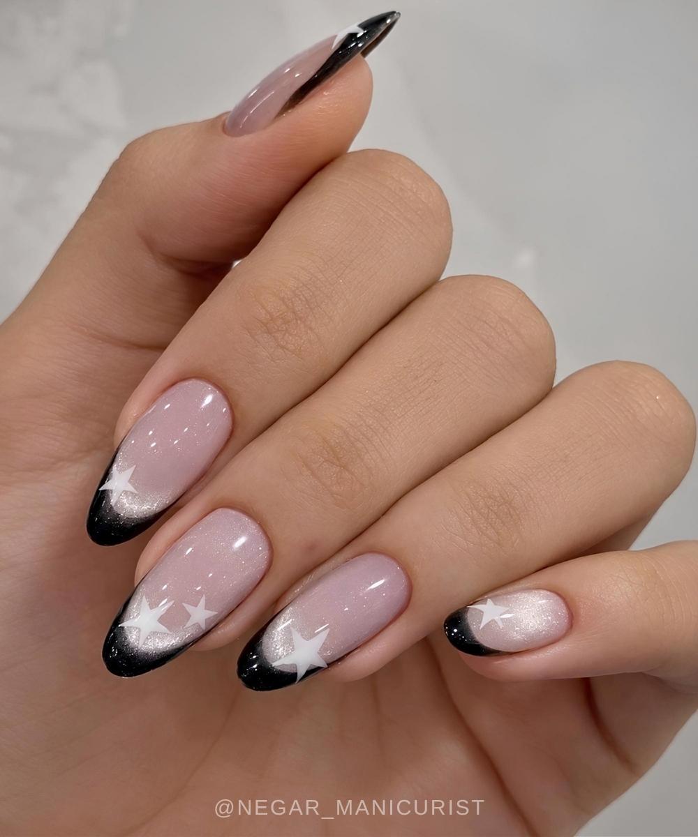 Starry black French tips on cat eye base