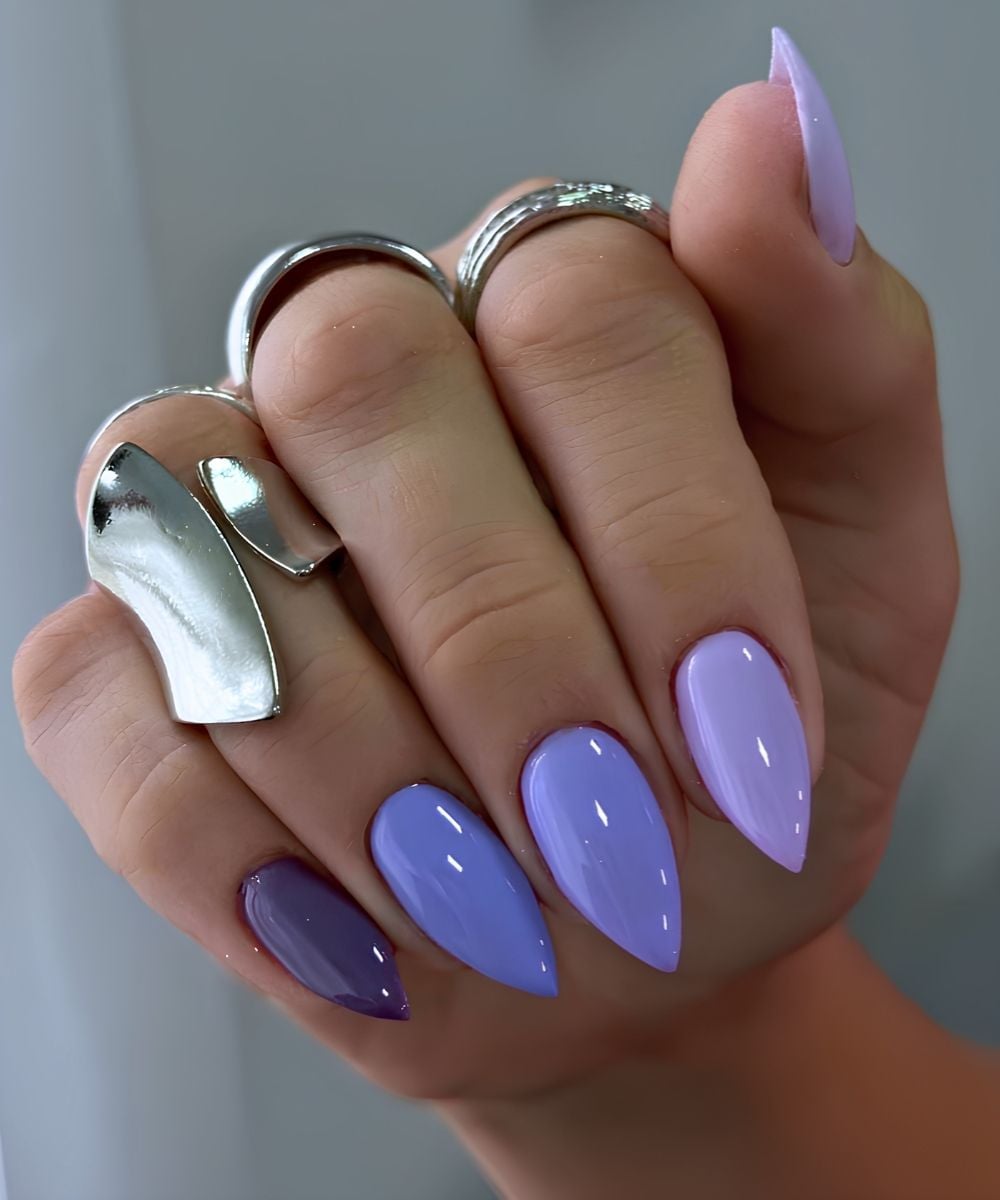 Stiletto purple skittle manicure