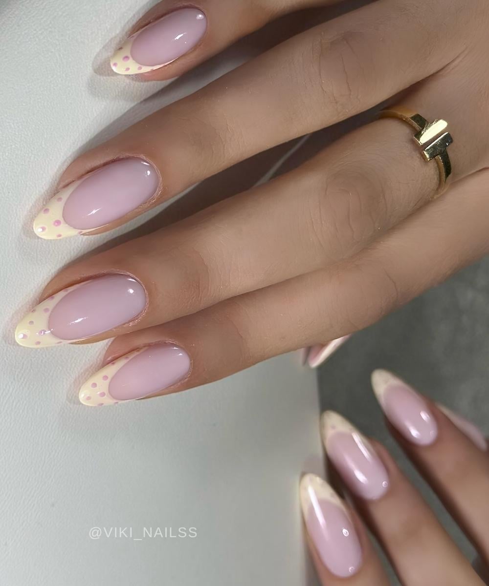 Vanilla French nails with pink polka dots