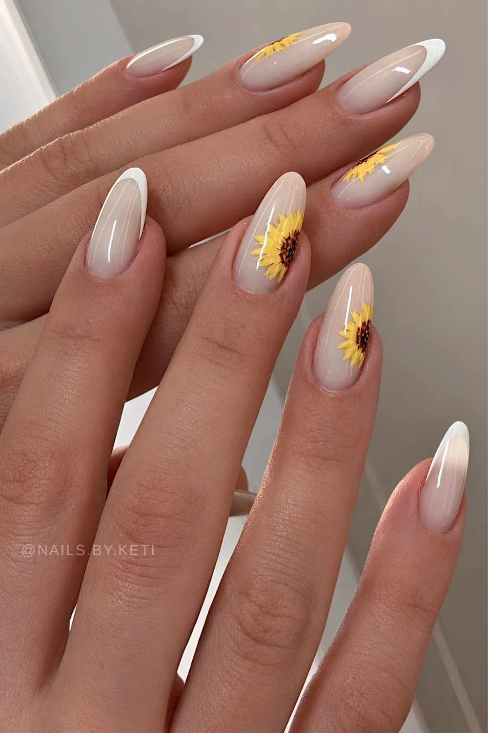 White French nails with yellow sunflowers