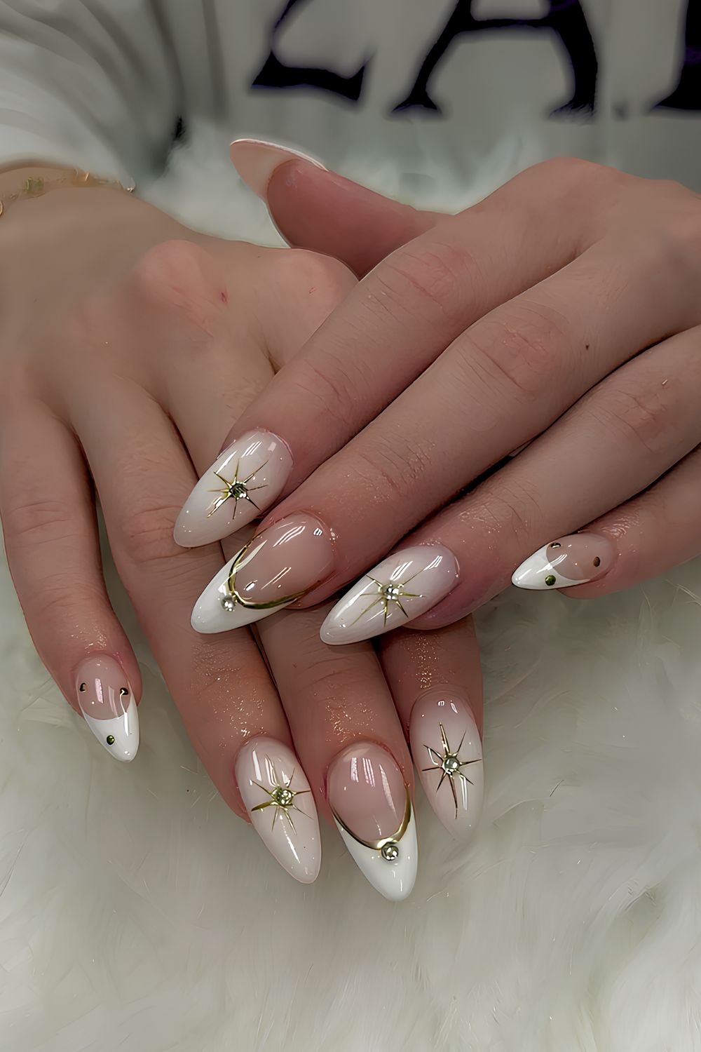 White mani with gold chrome stars