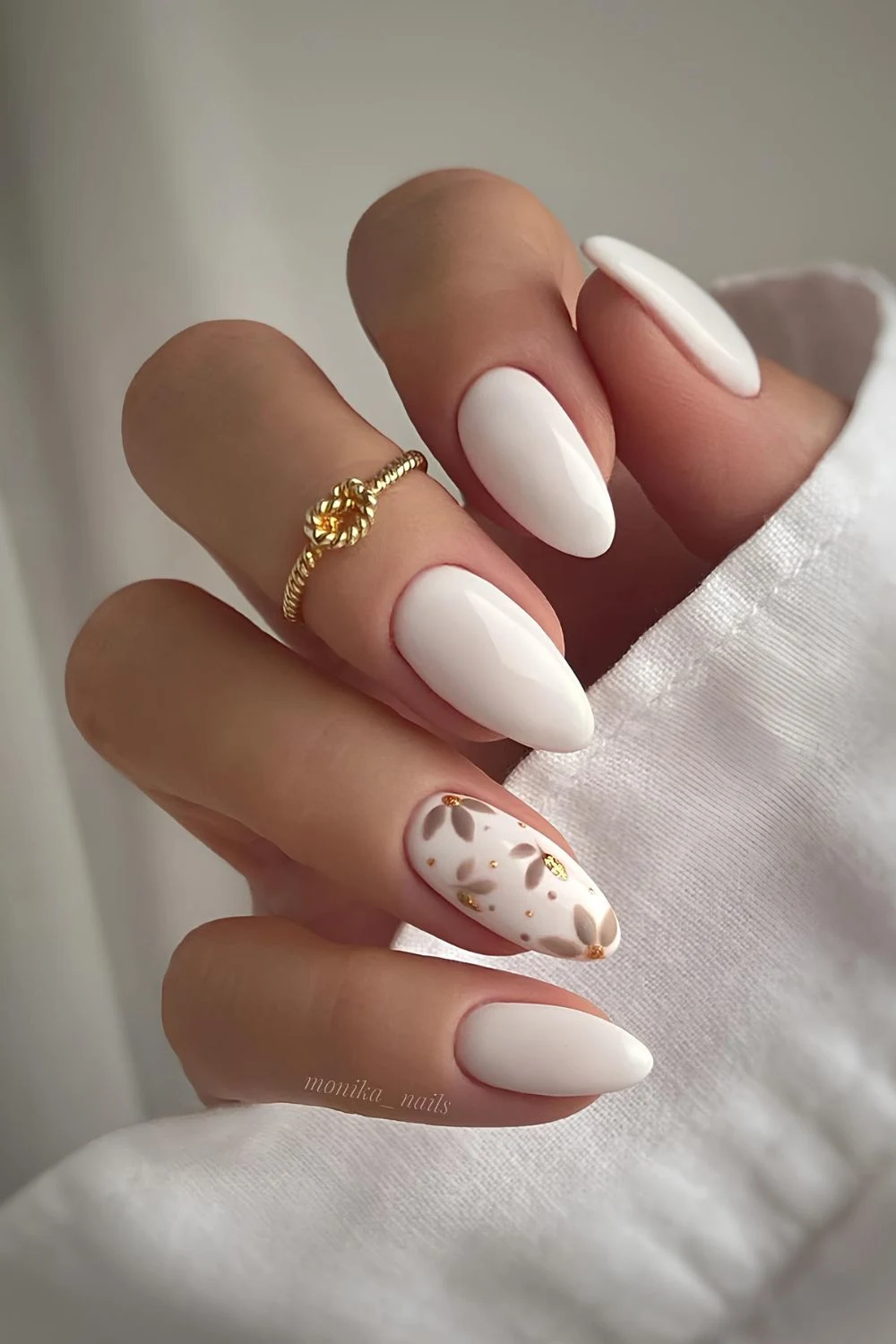 White mani with neutral flower art