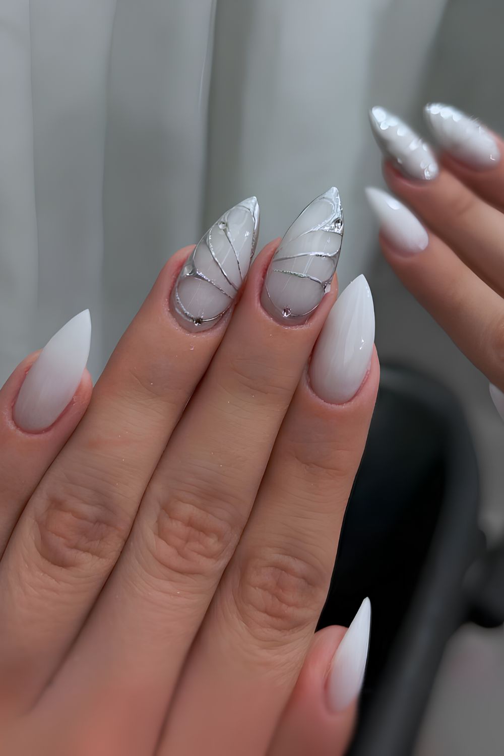 White mani with silver chrome butterfly accent