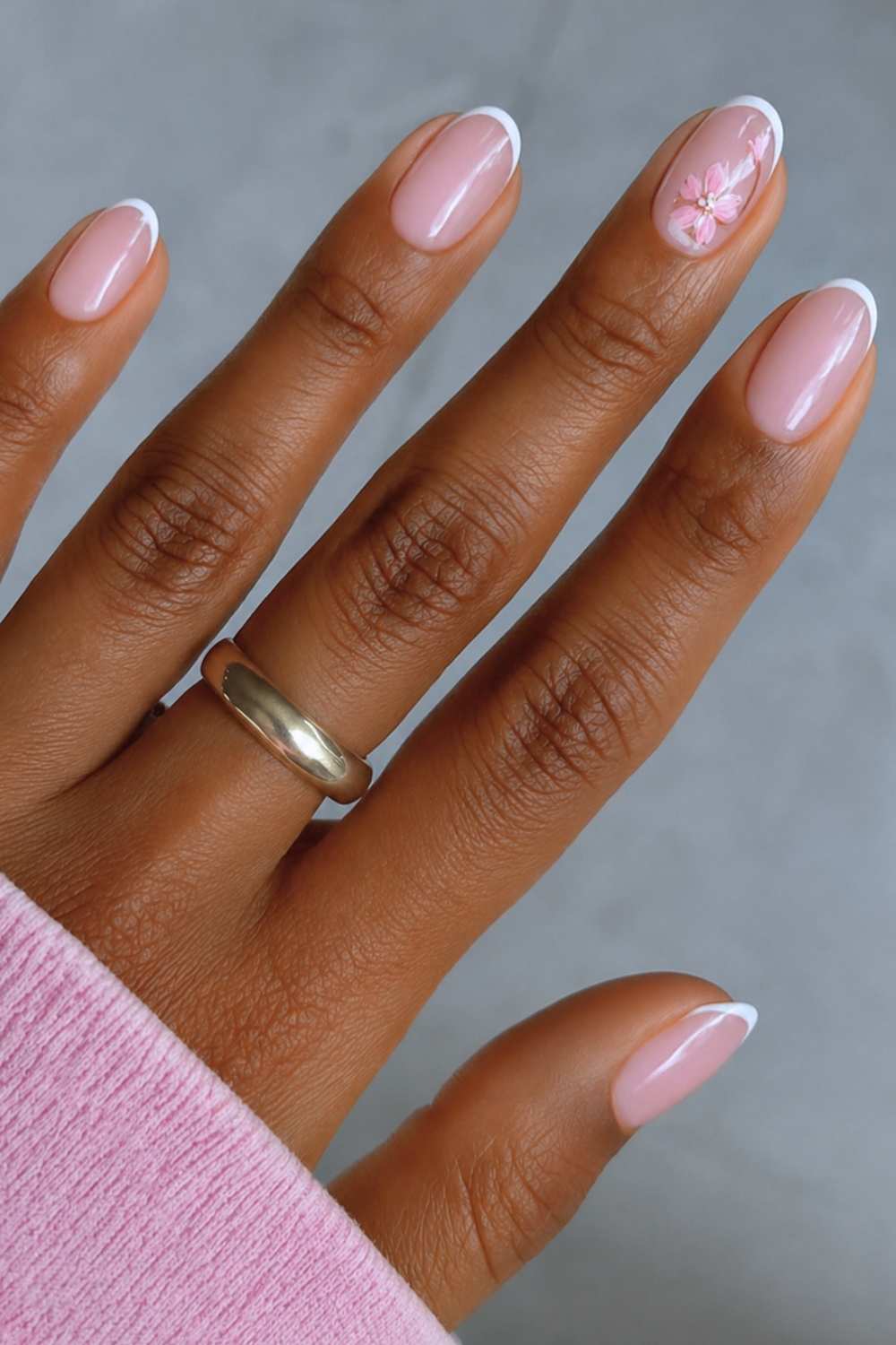 White micro French mani with sakura art
