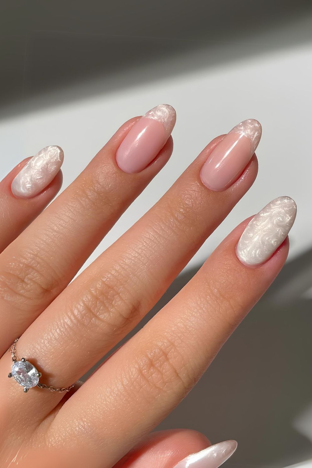 White pearl-swirl manicure