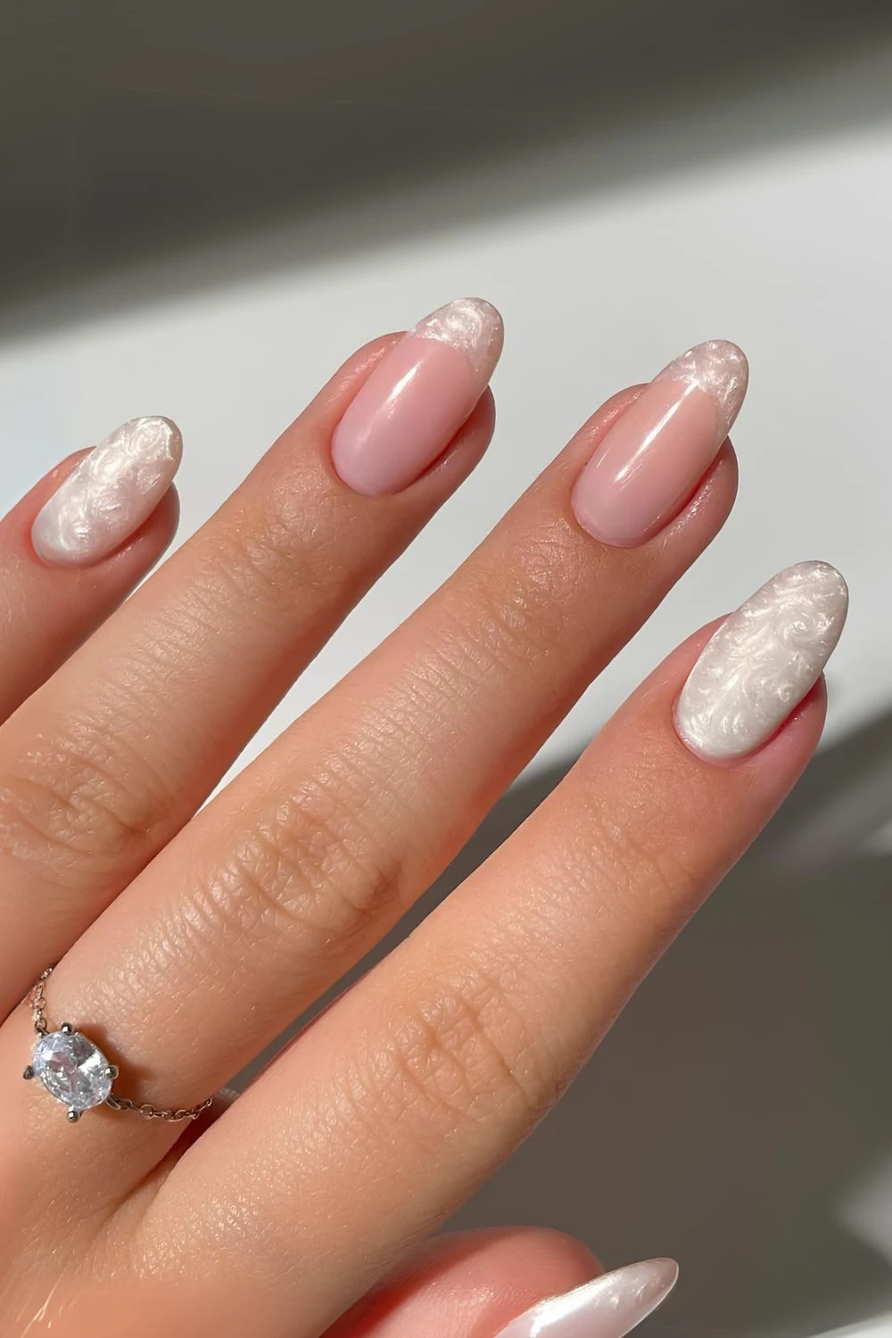 White pearl-swirl manicure