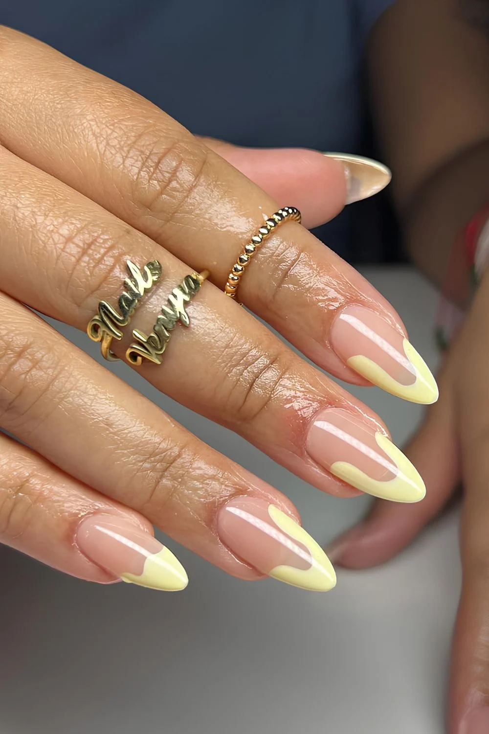 Abstract pastel yellow French tip nails