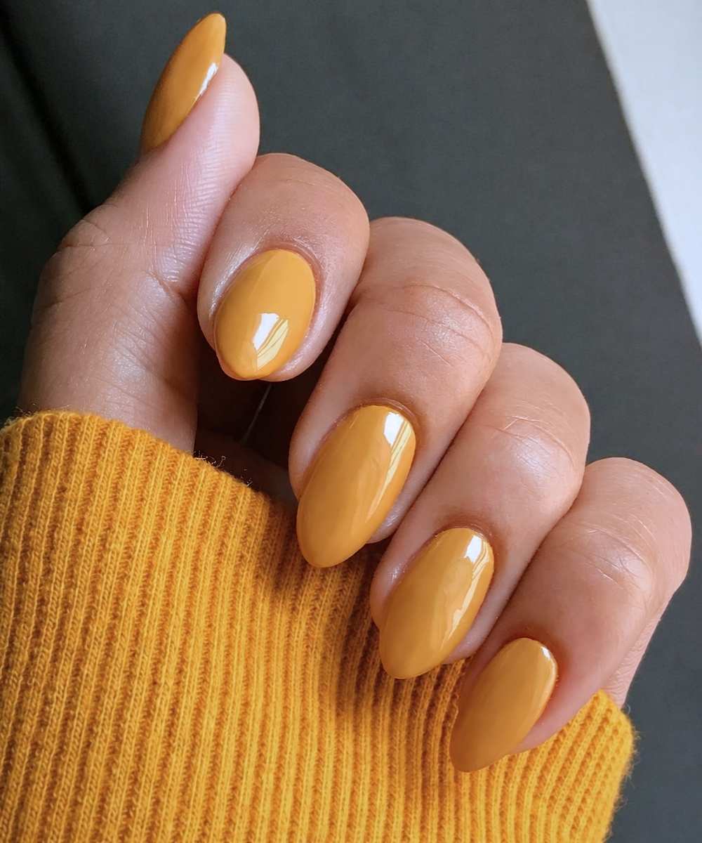 Almond shaped mustard yellow nails
