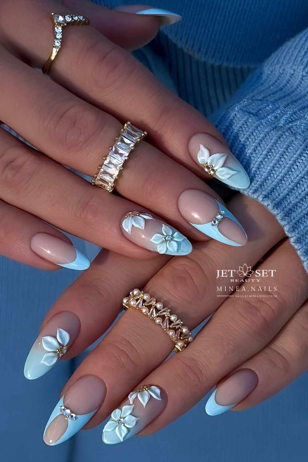 Baby blue mani with textured florals and gems