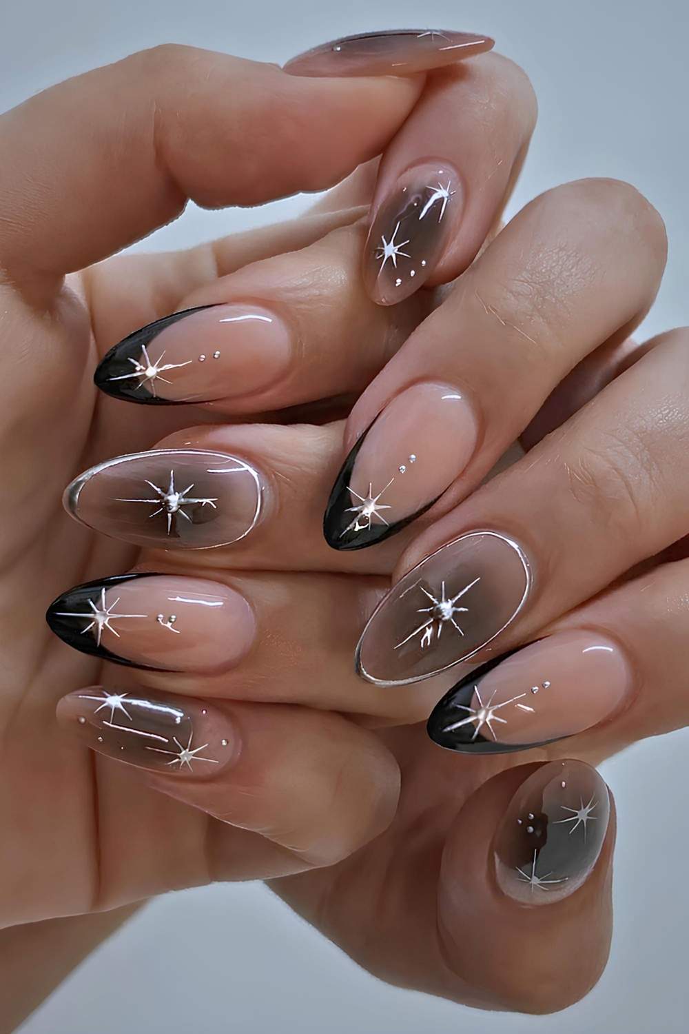 Black French nails with silver celestial art