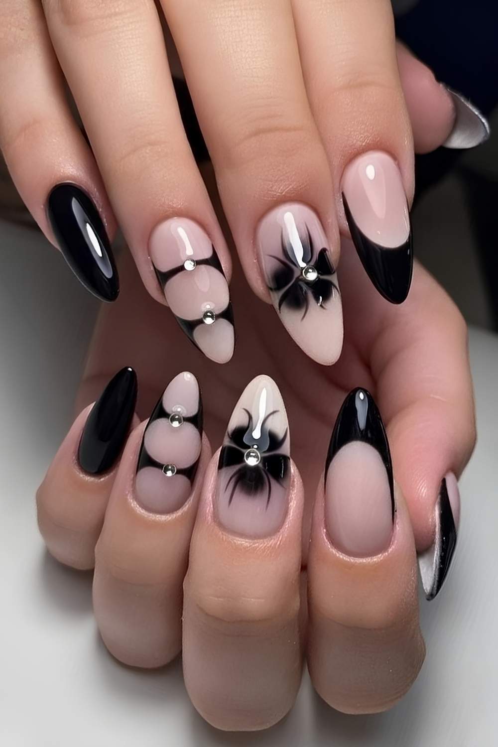Black nails with blooming gel flowers and gems